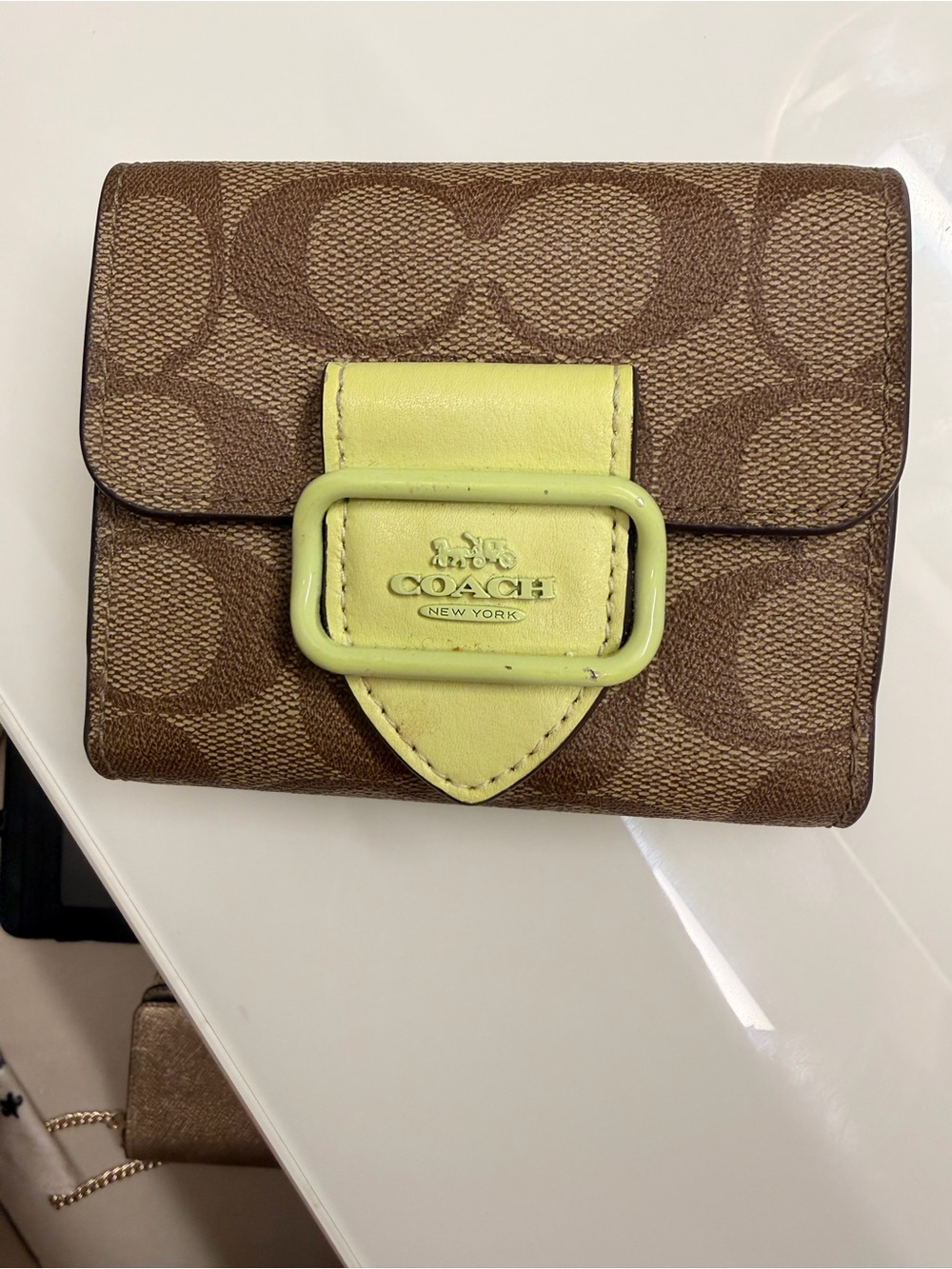 COACH Brown Signature Canvas Wallet with Yellow-Green Buckle